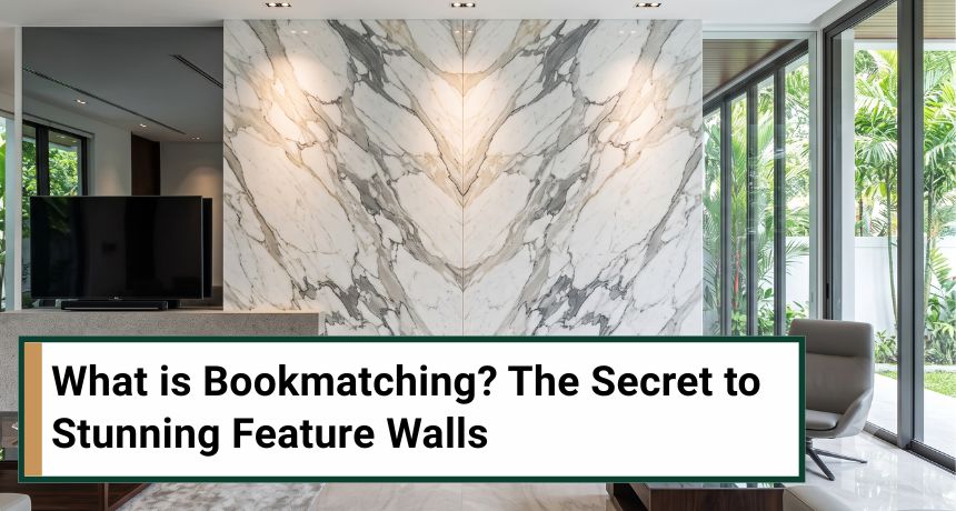 Symmetrical bookmatched white and grey marble wall panel in a bright modern living room with a garden view.